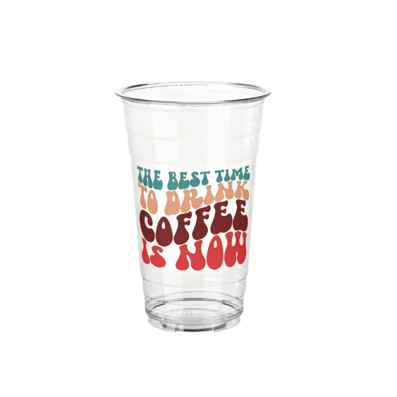 Clear plastic cup with retro stacked lettering reading “THE BEST TIME TO DRINK COFFEE IS NOW” in teal, tan, and red on a white background.