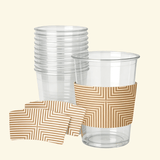 Stack of clear plastic cups with one cup wrapped in a tan sleeve with an optical geometric stripe pattern; two matching flat sleeve samples are shown in front.
