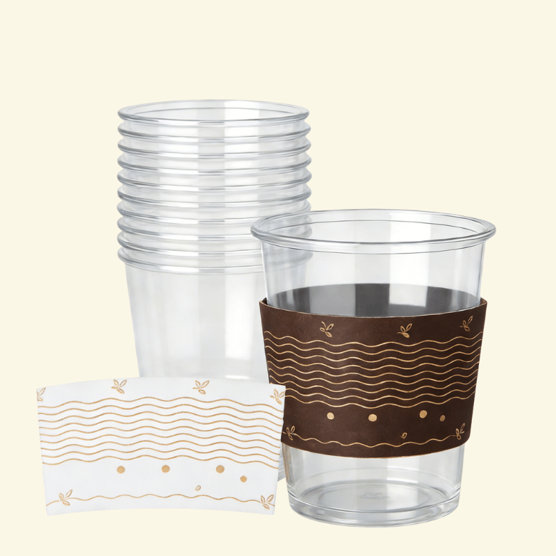 tack of clear plastic cups with one cup wrapped in a dark brown sleeve featuring wavy line art and small leaf accents; a matching flat sleeve sample is shown in front.